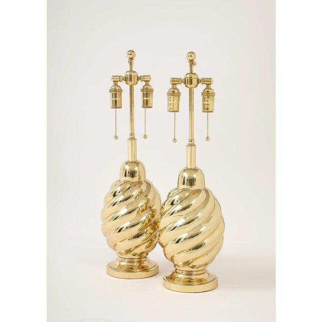 Pair of 1960's swirl lamps by Westwood industries. The lamps have been Newly re plated and have a mirror brass finish....
