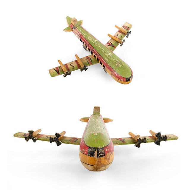 Wooden model of a U.S.A. Airlines plane. Old wooden children's game. All parts of this object are made of wood. This piece...