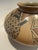 The product is a handmade piece of Mata Ortiz pottery signed by Miguel Lopez, a renowned Mexican artist. This piece of...