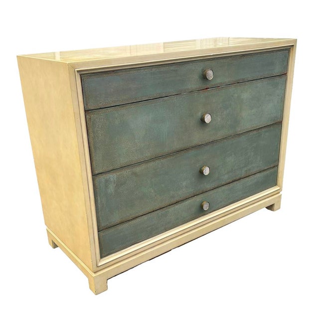 Rectangular with the case lacquered to imitate vellum. Three drawers with leather and glazed surface. Mother of Pearl...