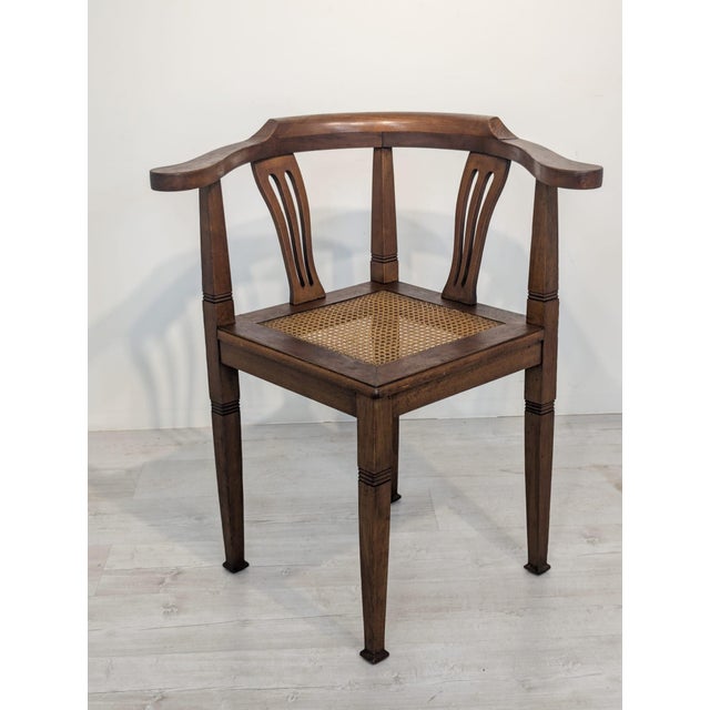 Stylish Art Nouveau corner armchair with a raffia seat from the 1920s/1930s. Solid wood construction with characteristic...