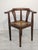 Stylish Art Nouveau corner armchair with a raffia seat from the 1920s/1930s. Solid wood construction with characteristic...