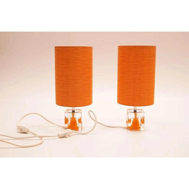 This vintage Space-Age set of table lamps is a real eyecatcher. With brightly orange coloured shades and chromed fixtures,...