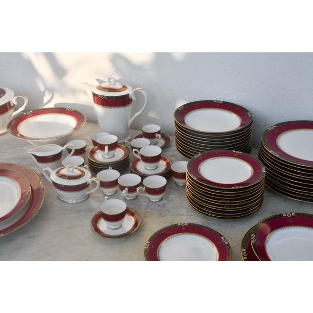 This elegant mid-century Japanese bone china dinner service by Keito Japan, known as White Bon Noble Red, is a refined and...