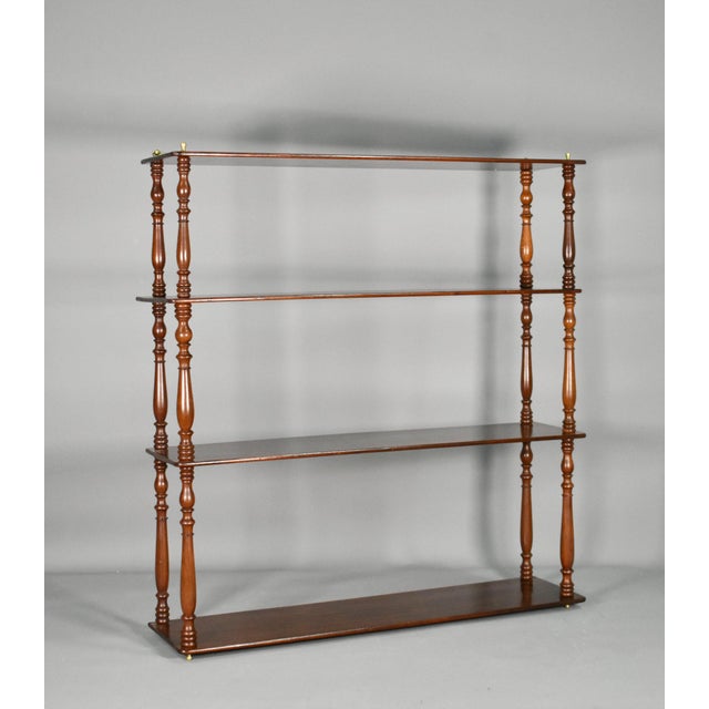 An elegant French mahogany wall shelf / étagère dating from the Napoleon III period, featuring four tiers supported by...