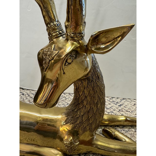 Large lovely pair of brass deer sculptures with impressive scale and details. PR
