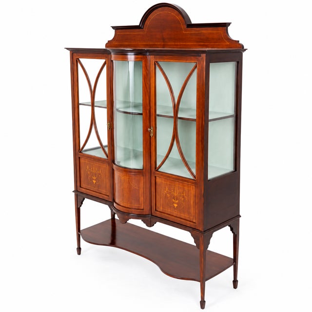 Superb Sheraton Revival mahogany display cabinet with elegant proportions and exquisite decorative detailing Raised on...
