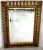 Hollywood Regency gilt ring motif mirror, with inset 35" x 23" beveled mirror, with continuous gilt pierced oval rings