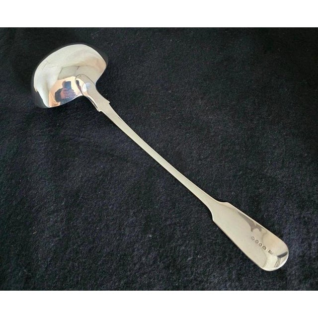 A substantial george iv sterling silver soup or punch ladle by clement cheese, fully hallmarked in london for 1829....