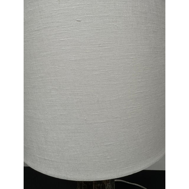 Custom lamp, antique wooden fragment on acrylic base. includes harp, finial and shade. Antique wooden fragment base is 13"...