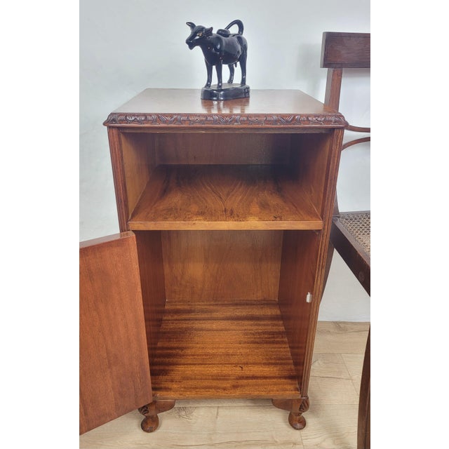 This is a gorgeous mid 20th-century Walnut bedside cabinet that exudes a timeless charm, perfect for adding a touch of...
