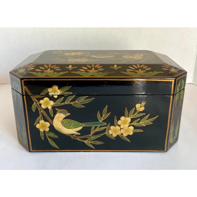 This vintage Chinoiserie-style jewel box dates to the late 20th century and features hand-decorated bird and blossom...