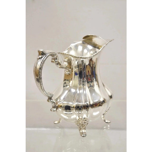 Vintage Lancaster Rose by Poole 401A EPCA Silver Plated Water Pitcher. Circa Mid 20th Century. Measurements: 9" H x 10" W...
