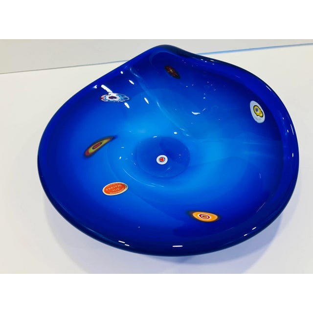 This brilliant blue Murano glass dish is signed Lavorazione Arte , Made in Italy Mint condition 70’s vintage