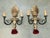 Pair of bronze two-lights Caldwell sconces with urn-shaped backplate. Original patina. Beautiful and elegant pair of...