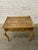 Charming side table in the timeless French Provincial style from Baker. Handmade of walnut with burl walnut veneers, the...