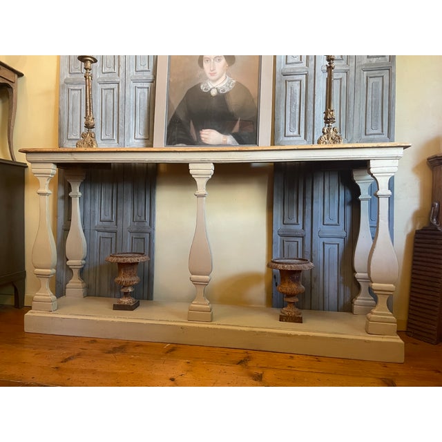 A magnificent antique baluster side table from France. The table features 5 flat and beautifully shaped pillars. 3 in...