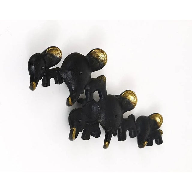 A charming and rare key holder, displaying five elephants in different sizes. A very humorous design by Walter Bosse,...