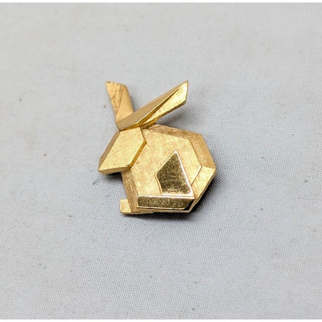 1970s goldtone "origami" rabbit brooch with security clasp. Marked crown "TRIFARI©" on the back. Measures: 1 1/4 inches...