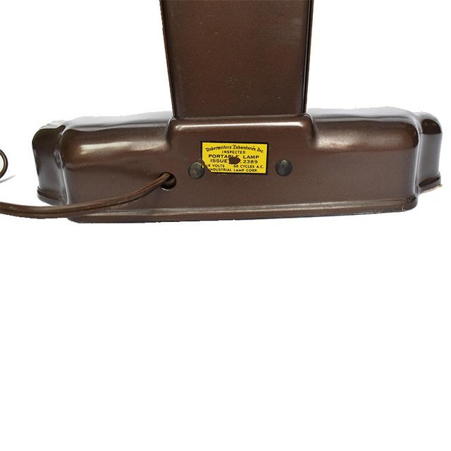 Mid Century Modern Brown task lamp or library lamp. Featuring an elongated top with long light and a shorter base, all in...