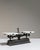 Made in France around 1900, this balance scale pairs a heavy cast iron beam and base with two pans of white marble. A...