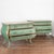 This stunning pair of Italian rococo commodes retains their remarkable original green painted finish highlighted in gold...