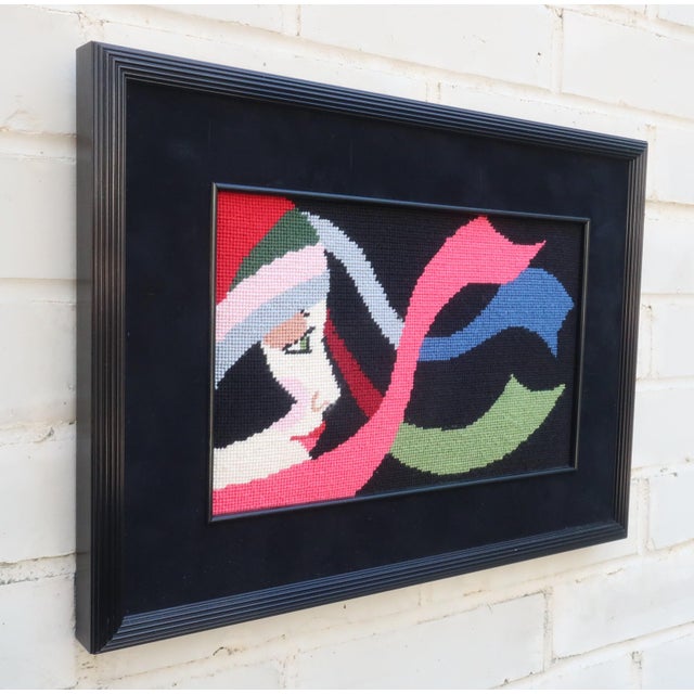 This needlepoint wall hanging is loaded with an Art Deco revival style. It features a flapper girl complete with rosy...