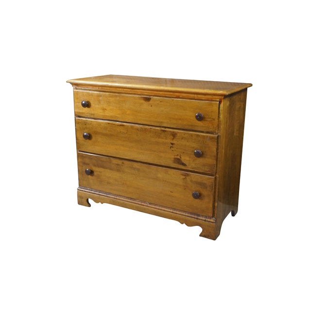 This early 20th-century chest of drawers features a classic, rustic design beautifully crafted from a combination of maple...