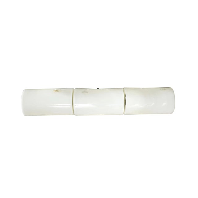 This minimal and materially gorgeous Mid-Century Modernist Hand-Blown Milk Glass Vanity Light originates from France,...