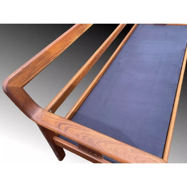 This sofa is made out of solid teak wood and brown leather which is in good vintage condition. Excellent design of a sofa...