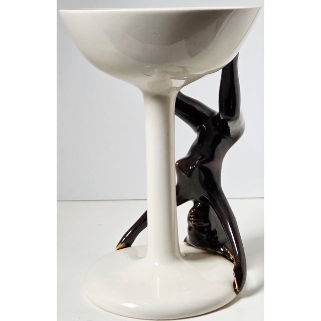 A rare sculptural figural chalice attributed to the John Todd Company of Seattle, known for its limited‑production...