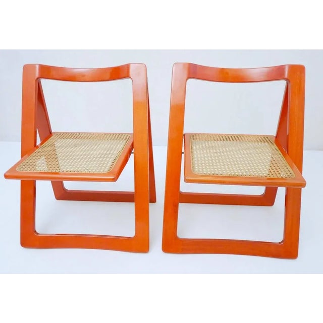 Set of 2 folding chairs model "Trieste" by Jacober - D'Aniello for Bazzani, Italy 1960s Structure in ringed and varnished...