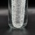 A striking vintage Alfredo Barbini Murano art glass vase featuring a tall, sculptural clear-glass form with a dramatic...