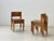 An elegant set of four stackable wooden chairs with a clean, architectural design. The chairs impress with their...