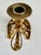 Charming and finely crafted candle holder made of cast brass or bronze and gilded. The base is a horseshoe, with detailed...