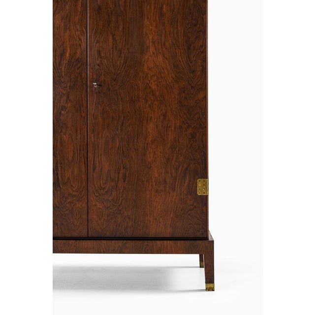 This rare cabinet or wardrobe, designed by palle suenson and produced by i.c.a. Jensen in denmark during the 1930s,...