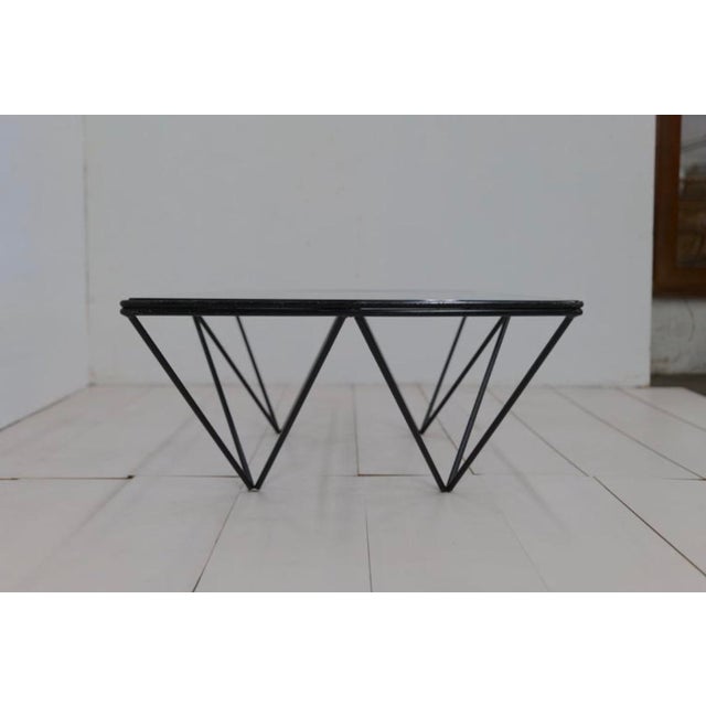"Alanda" model coffee table, design Paolo Piva for B&B italia, 1980s. Inverted pyramid structure in black steel and 1 cm...