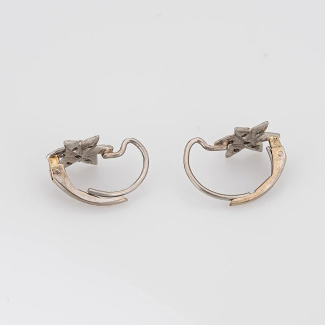 Elegant pair of Cathy Waterman small diamond star earrings crafted in 900 platinum and 14k white gold. Fourteen round...