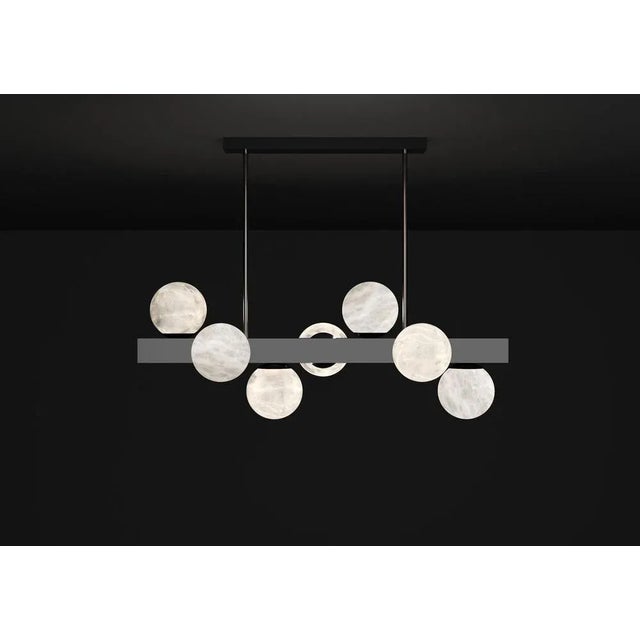 Dioniso shiny black metal pendant lamp by alabastro italiano dimensions: d 35 x w 91 x h 36 cm. Materials: white alabaster...