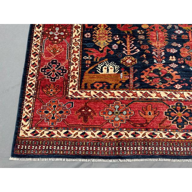 This rug is from Afghanistan, measuring 8'2 x 10'0" ft. Featuring earthy tones and a tribal look, it will enhance the...