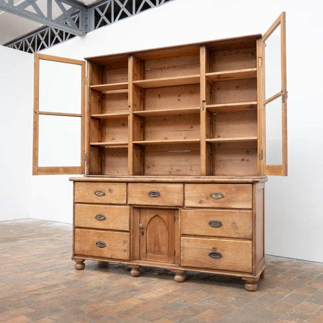 Antique pine sideboard, composed of two separable sections for easy transport and installation. The lower section features...