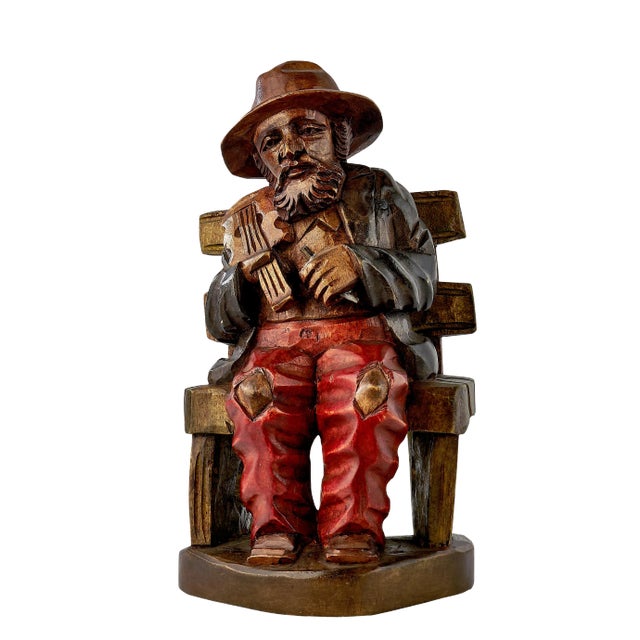 Vintage Wood Carving of a Peasant Fiddler Seated on a Bench For Sale