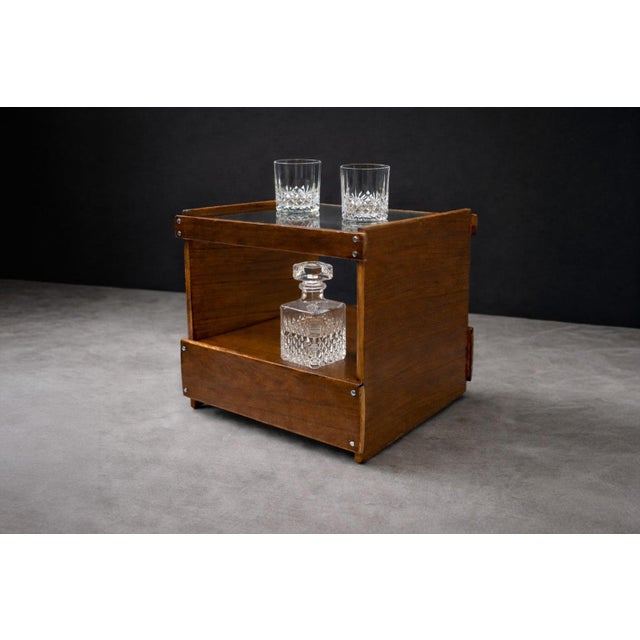 Attributed to Sergio Rodrigues (1927–2014), this bar cart reflects the relaxed material sensibility and structural...