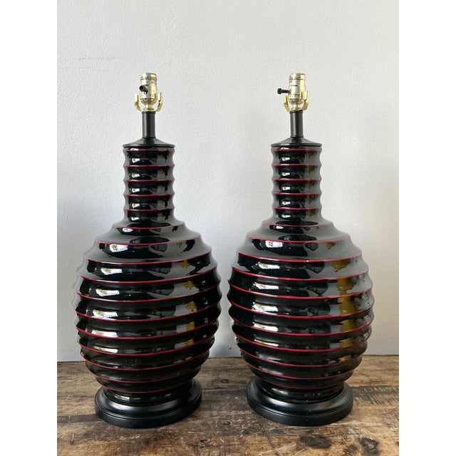 This elegant pair of vintage ceramic table lamps exemplifies the sculptural sensibility of mid-20th-century modern design....