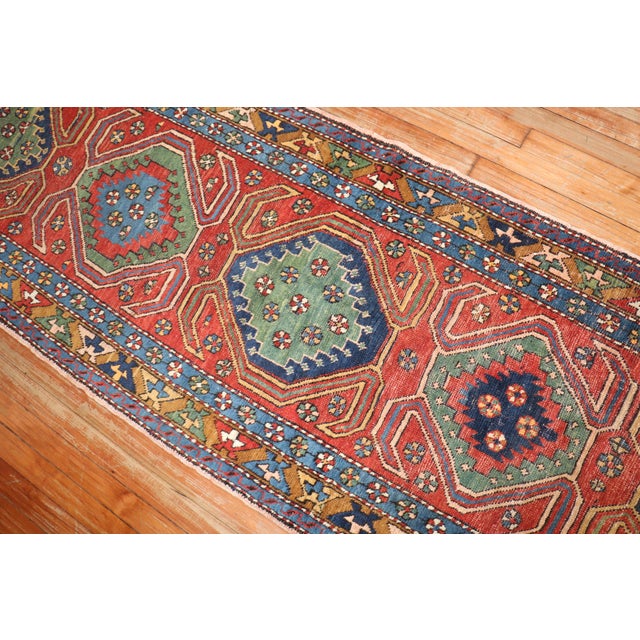 Colorful antique Persian Heriz runner from the 2nd quarter of the 20th century with an all-over geometric motif 2'7'' x...