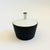 A mid century porcelain sugar bowl. Finished in contrasting glazes in matte black and glossy white. Perfect for storing...