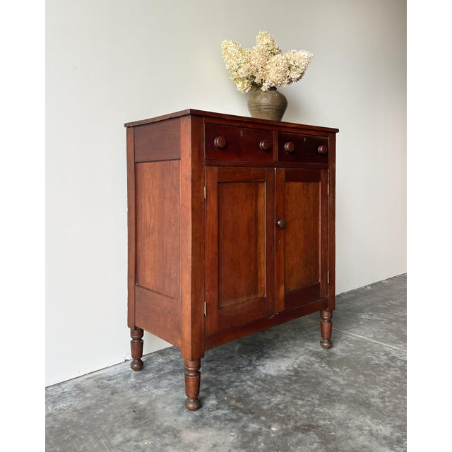 An exquisite mid 19th-century American country pine jelly cabinet with lots of beautiful character and patina, double...