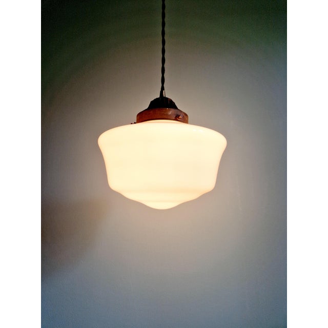 Art Deco pendant light in white opaline with a copper-plated metal claw, 1920s-30s. The pendant has been fully rewired and...