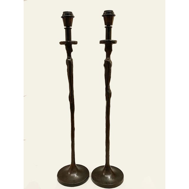 Evocative of Alberto Giacometti’s figurative sculptures, the Man and Woman pieces come as an odd pair. Constructed in cast...