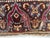 This is a pillow upholstered in a 19th century rug fragment, featuring charming tribal motifs. There is wear on several...